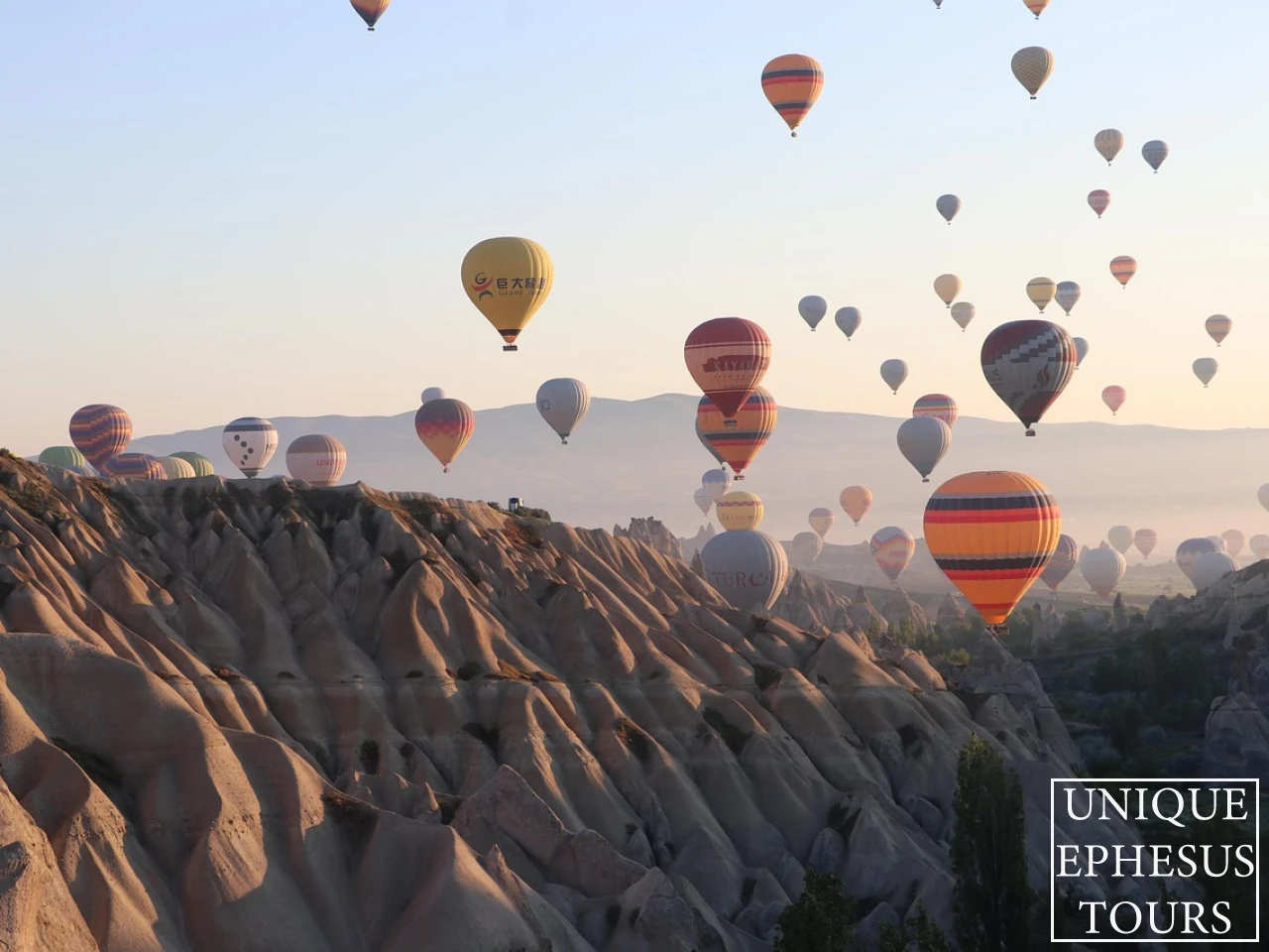 hot-air-balloons-sunrise-cappadocia-rock-formations-turkey